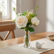 gjenstander Bukett med kunstige roser. Kremsilkeblomster i en bukett
