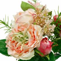 gjenstander Bukett med kunstige roser i en haug med rosa bukett av silkeblomster